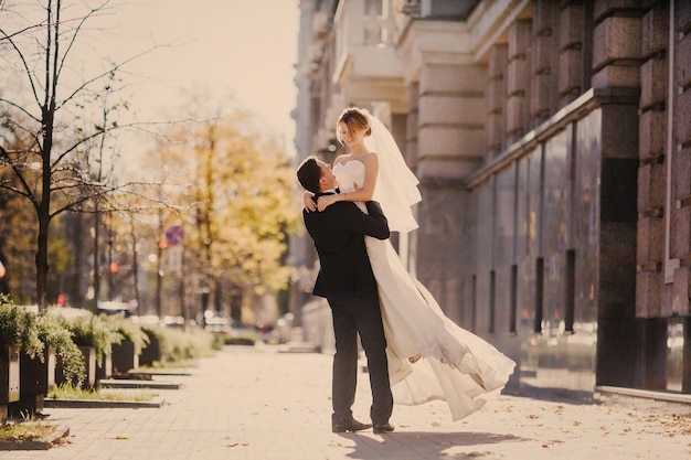 Husband lifting his wife