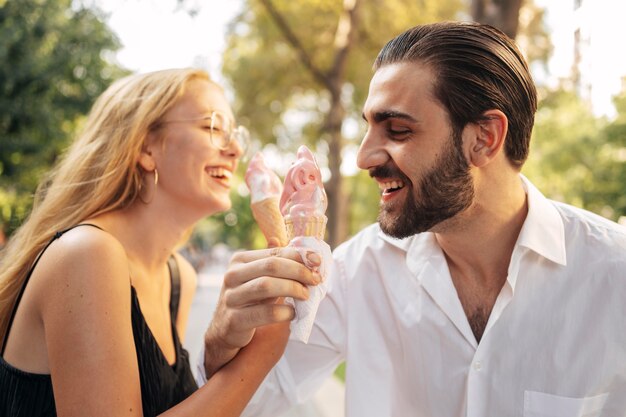 Husband and wife eating ice cream