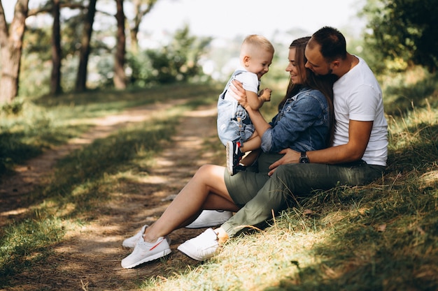 Husband with pregnant wife and their son