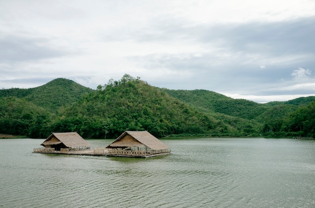 Free photo hut on river and forest