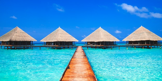 Free photo huts on the blue sea