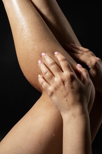 Hydrated legs skin texture with water drops