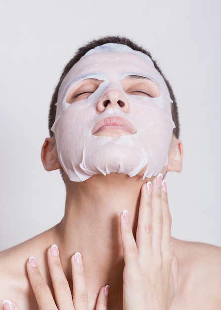 Hydrating face mask on beautiful woman