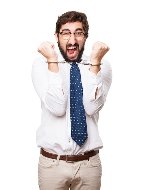 Free photo hysterical businessman with handcuffs