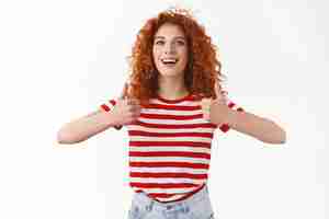 Free photo i agree good choice attractive charismatic satisfied redhead curlyhaired female approve fantastic work hairdresser show thumbs up smiling broadly express like approval good attitude recommend