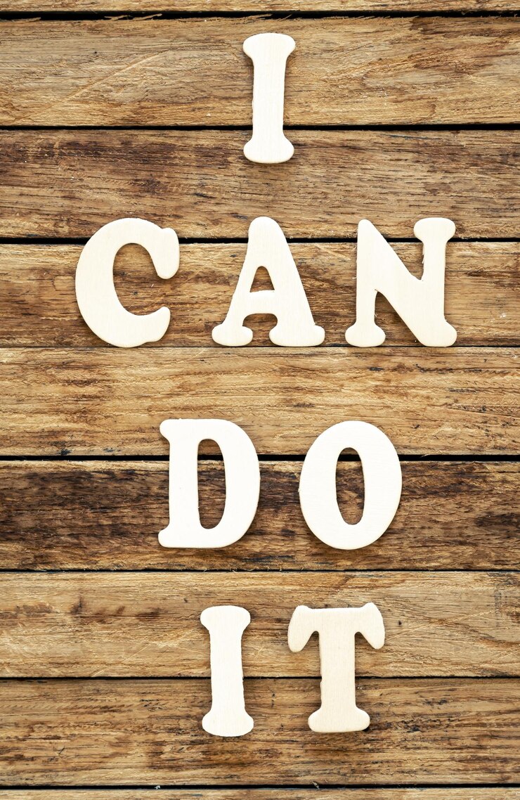 Free Photo i can do it words made of wooden letters on a wooden background