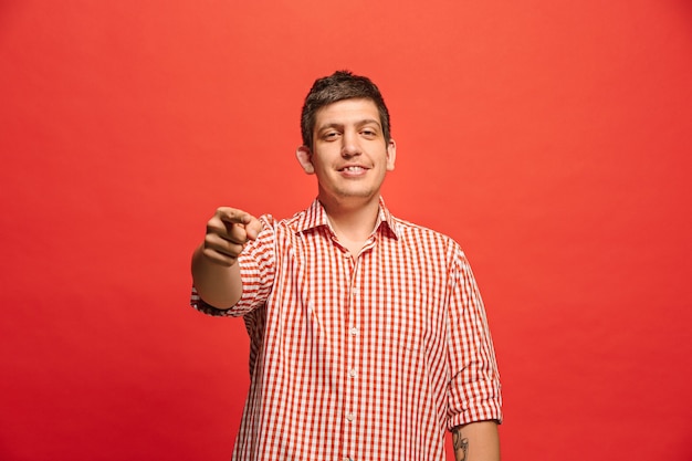 I choose you and order. Overbearing businessman point you, want you, half length closeup portrait on red studio background.