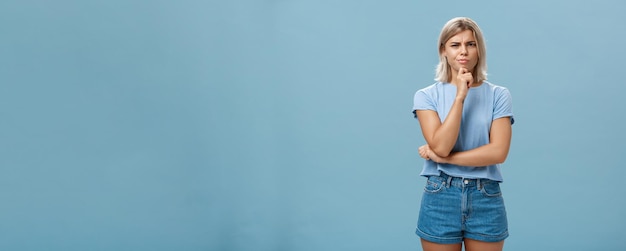 Free photo i doubt it good idea suspicious intense creative young female coworker in outdoor outfit frowning