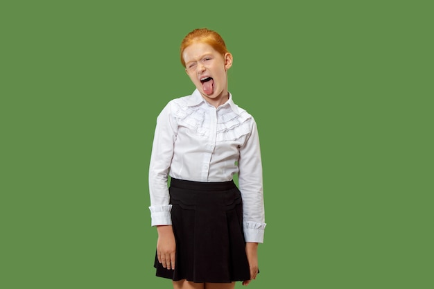 I lost my mind. squint eyed woman with weird expression. Beautiful female half-length portrait isolated on green