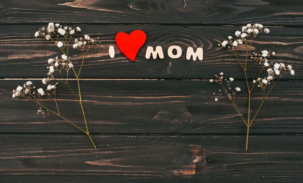 I love mom inscription with flower branches 