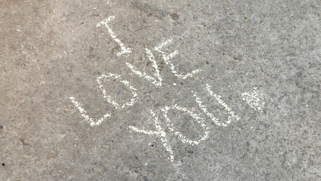 Free photo i love you inspirational quote in chalk on concrete