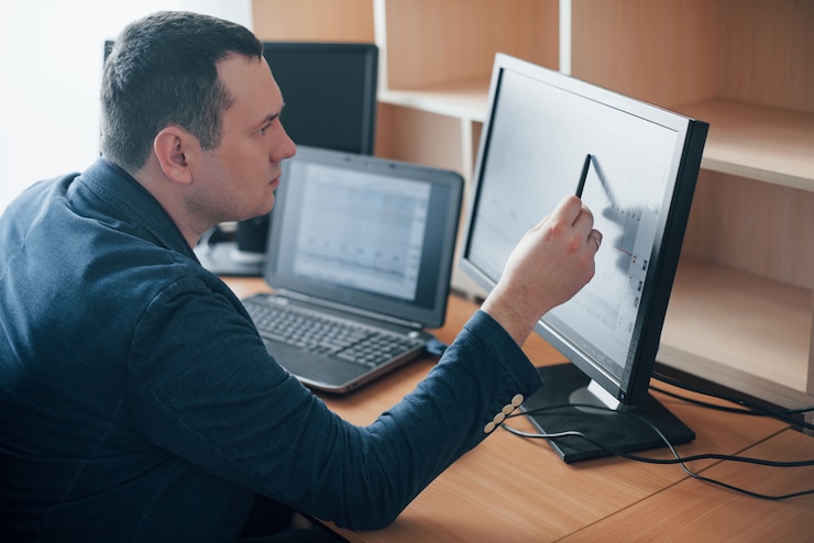 Free Photo i see how man had worried at this moment. polygraph examiner works in the office with his lie detector's equipment