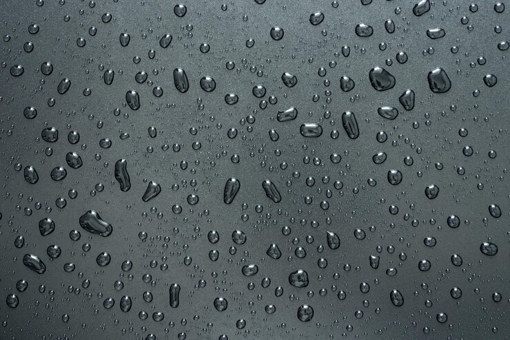 Ice and Cold Water Stain Drops on Dark Abstract Background