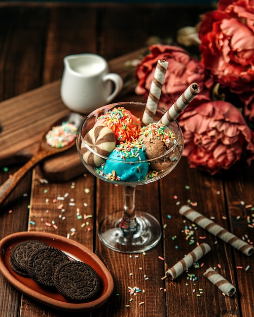 Ice cream balls topped with cookies and candies