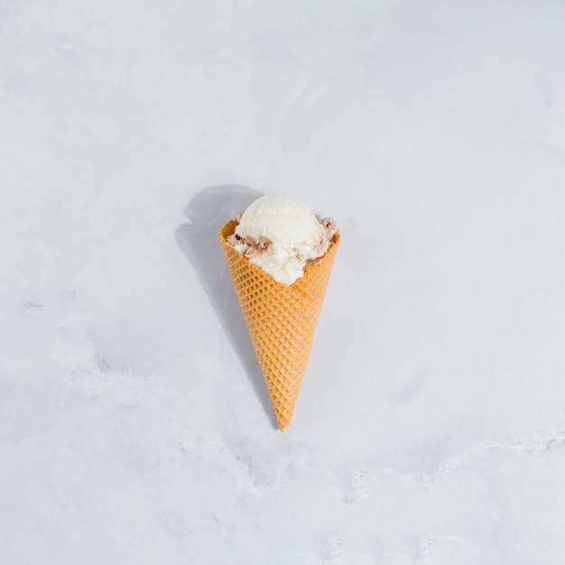 Free photo ice cream cone on marble