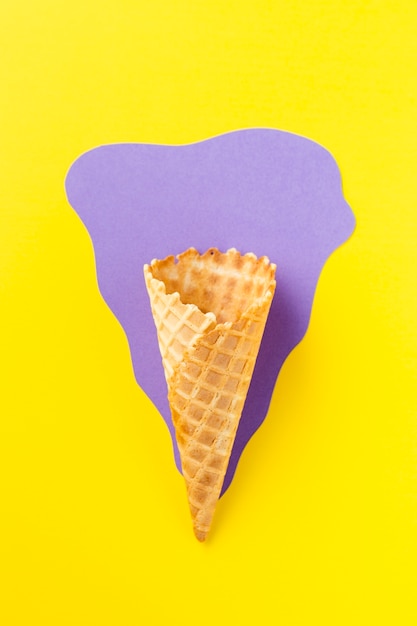 Ice cream cone on purple and yellow