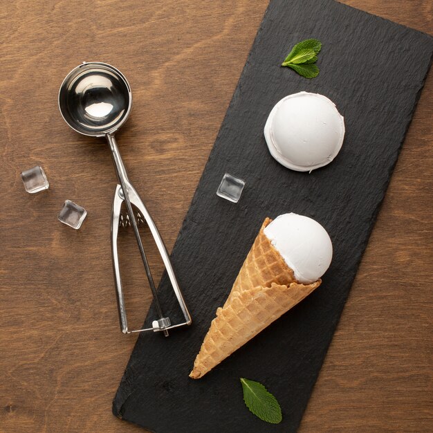 Ice cream on cone with ice cream scoop