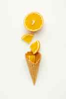 Free photo ice cream cone with orange