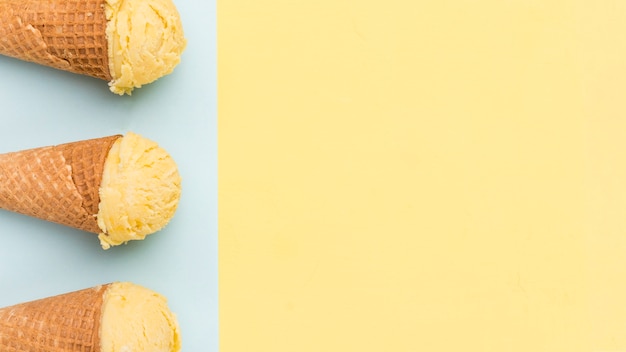 Ice cream cones on different color background