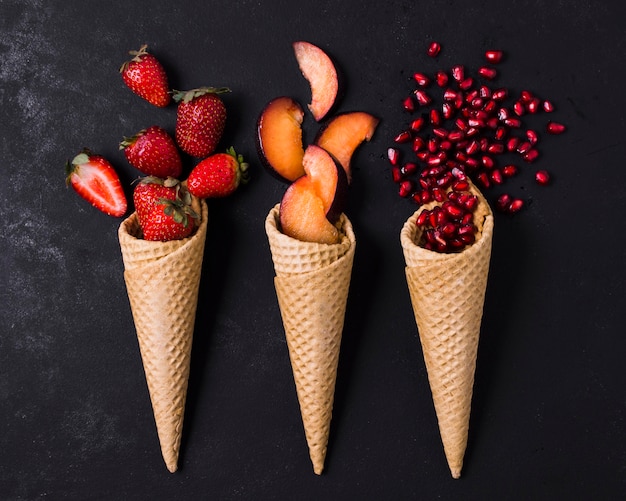 Free photo ice cream cones with fruits