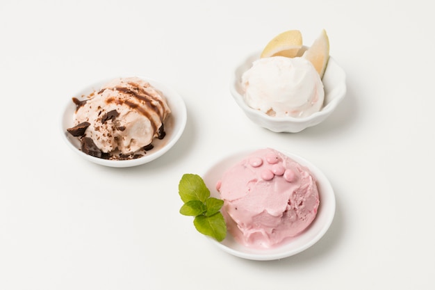 Ice cream on plates with chocolate and herb