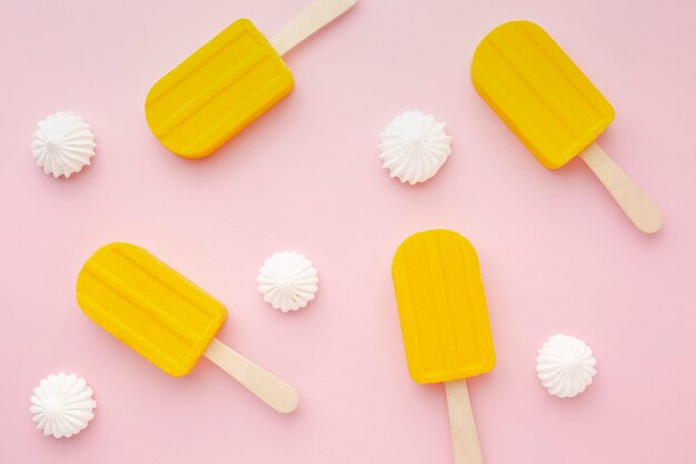 Ice cream on sticks on table