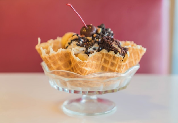 Free photo ice cream sundae in an edible waffle bowl