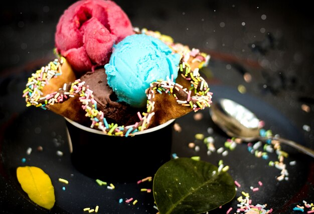 Ice cream in waffle with candies