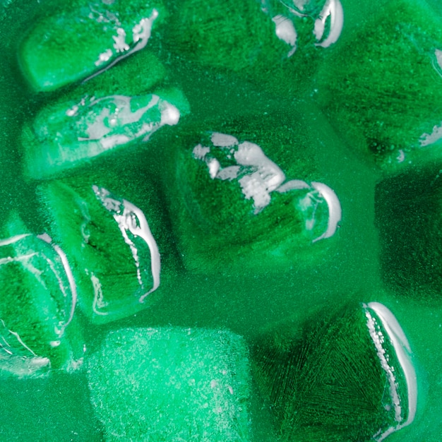 Ice cubes in green drink