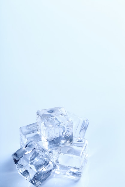 Ice cubes on white table with copyspace