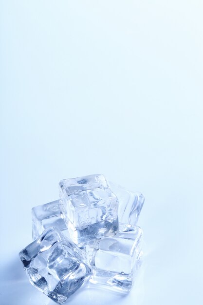 Ice cubes on white table with copyspace