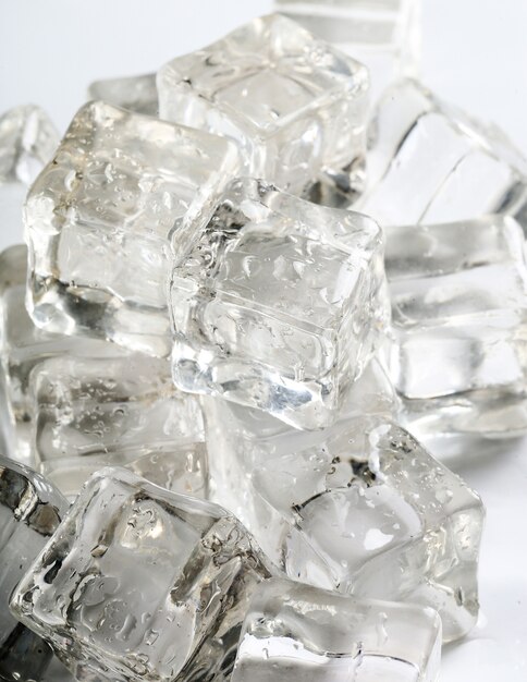 Ice cubes on white table