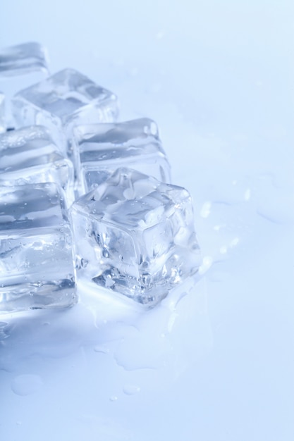 Ice cubes on white table