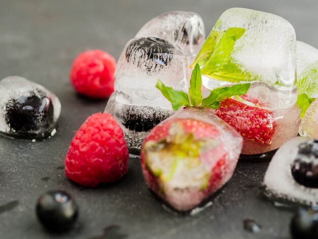 Ice cubes with strawberry blueberry and raspberry