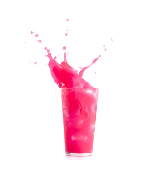 Ice falling in a glass with pink drink