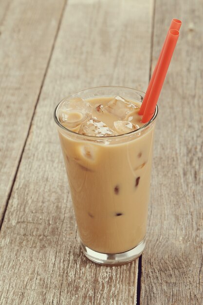 Ice latte with plastic straw