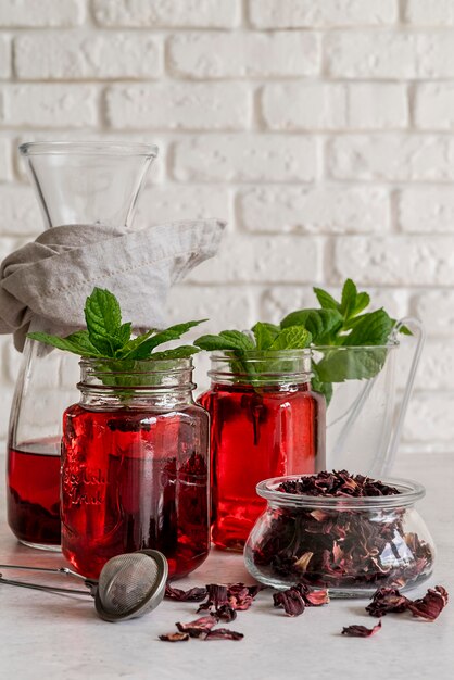 Ice tea with mint and fruit glass on desk