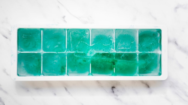 Free photo ice tray with turquoise blocks