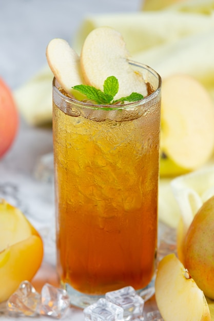 Iced Apple Tea Drink with Fresh Apples.