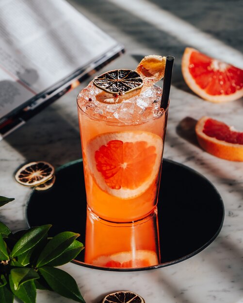 Iced grapefruit cocktail on the table