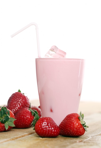 Iced pink cocktail and fresh strawberries