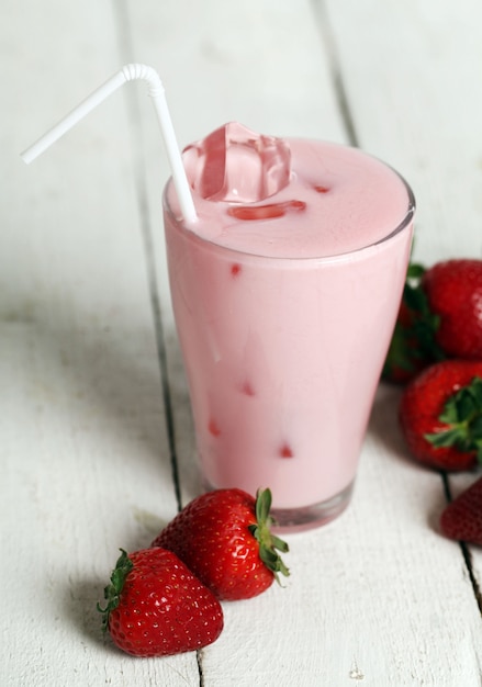 Iced pink cocktail and fresh strawberries