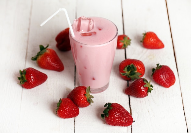 Iced pink cocktail and fresh strawberries