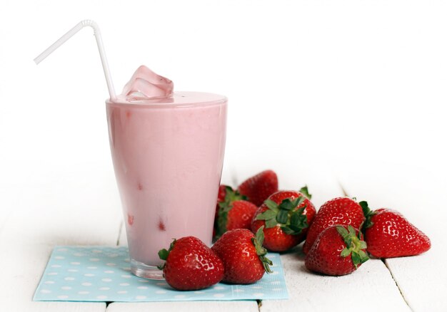 Iced pink cocktail and fresh strawberries