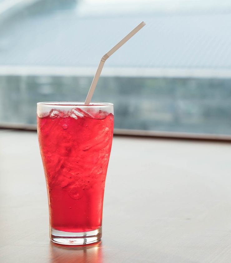 Free Photo iced red soda glass