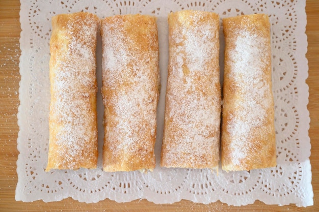 Iconic rustic romanian and moldavian pies with white sugar powder sour cherry filing