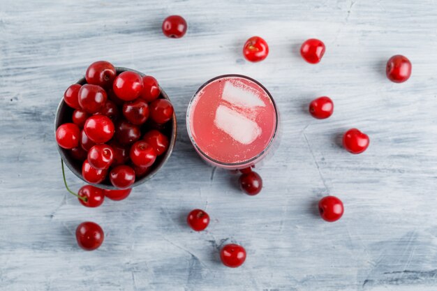 Icy cocktail with cherries in a jug.