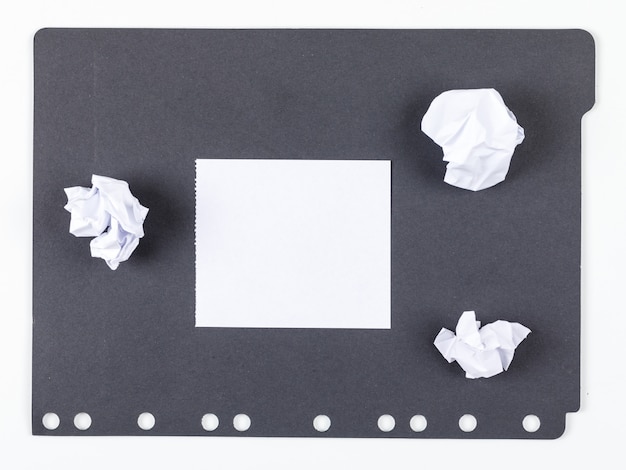 Idea concept with paper, crushed paper on white and black background top view. horizontal image