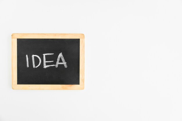 Idea text written on slate over the white background