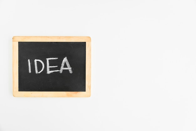 Idea text written on slate over the white background